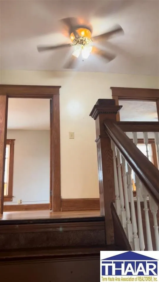 A view of the hallway from the stairs.