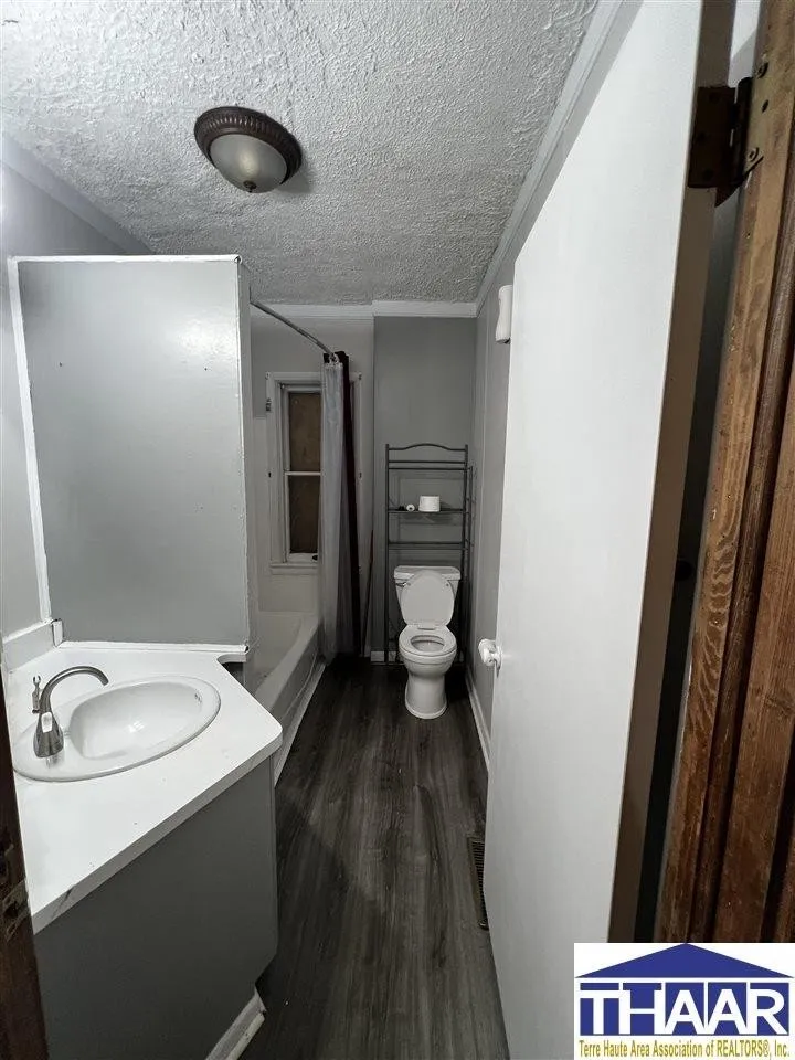 A bathroom with a toilet and sink in it